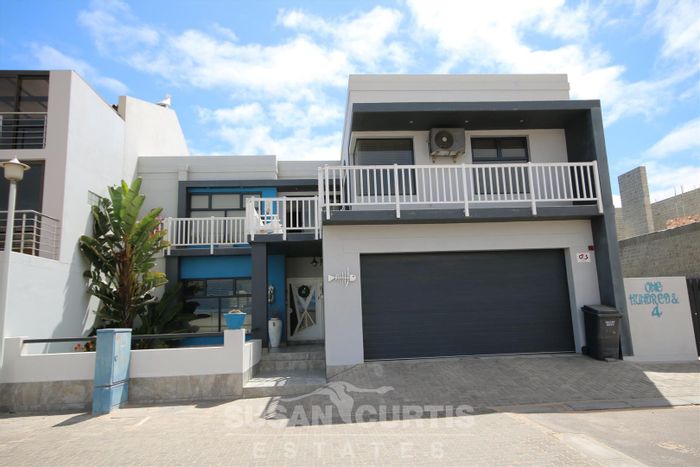 Long Beach House for Sale: Versatile Living, Outdoor BBQ, Semi-Sea Views!