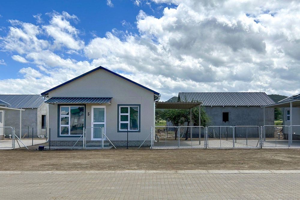 Freestanding townhouse with provision for future expansion and carport.