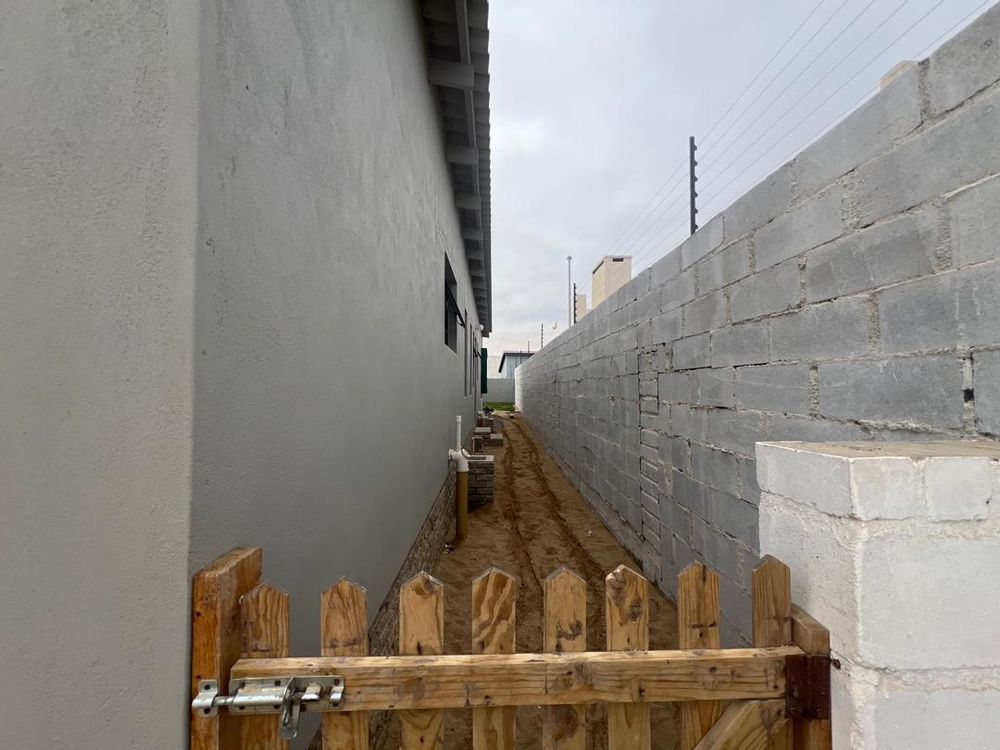 Back courtyard leading to front yard