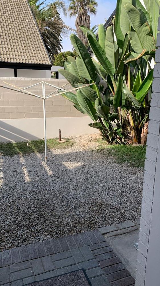 Outside area next to the laundry room and a place to hang washing