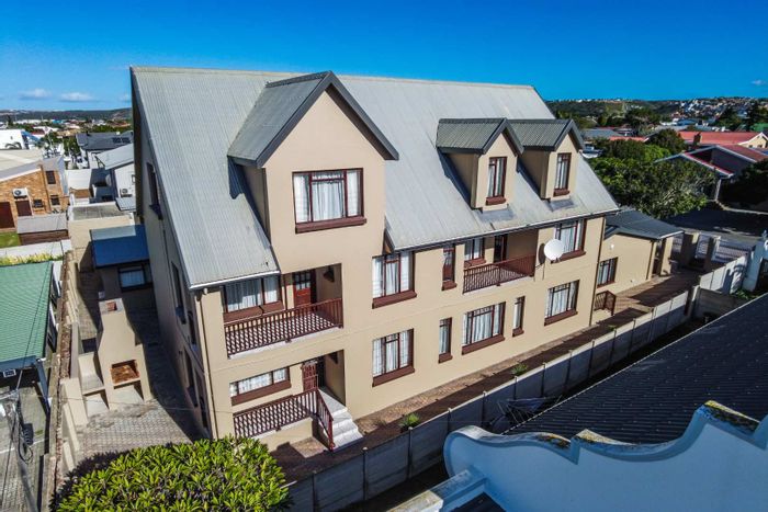 For Sale: House in Hartenbos Central with five apartments, braai facilities, and parking.