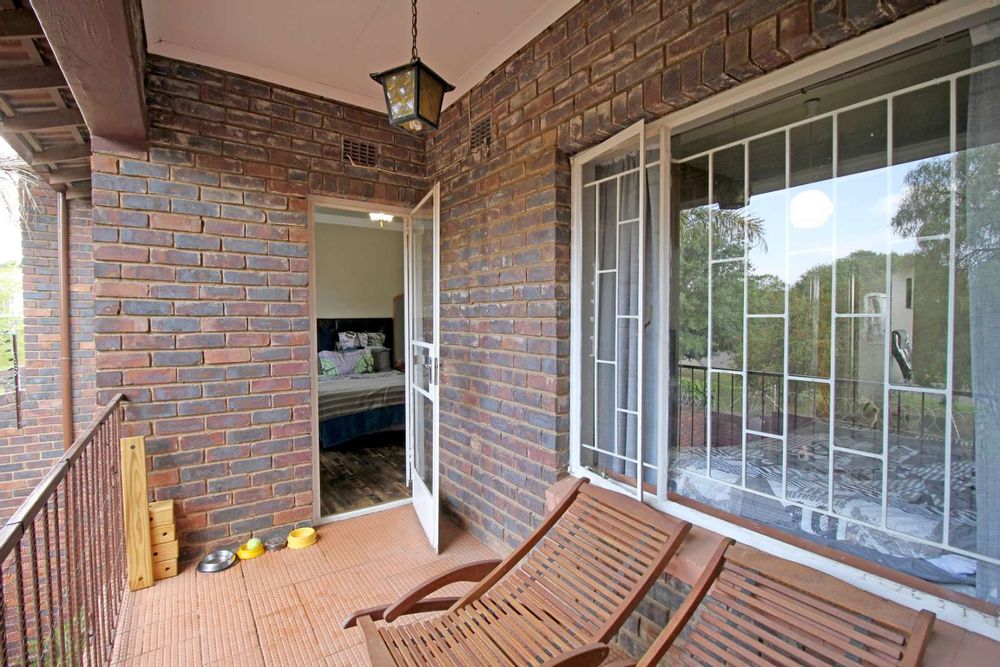 BALCONY FROM MAIN BEDROOM OVERLOOKING THE GARDEN TERRACE