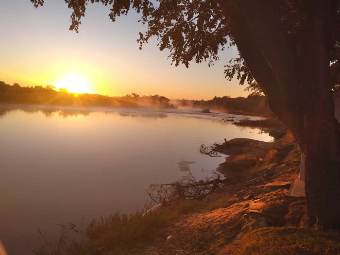 Rundu Central Small Holding For Sale: River views, wildlife, fruit trees, tourism access.