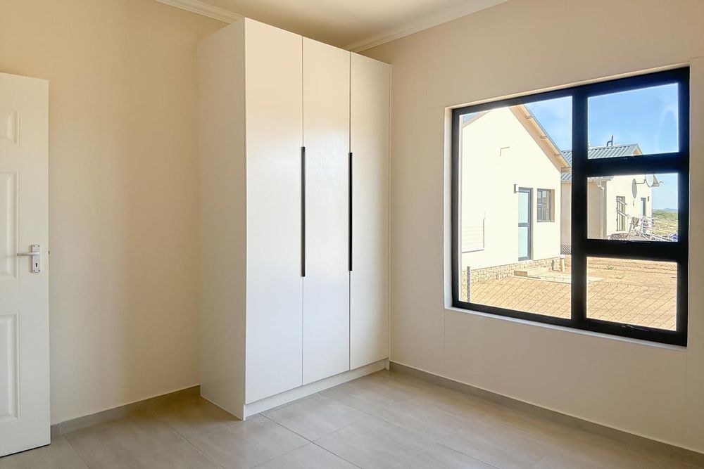 Third bedroom with built-in cupboards.