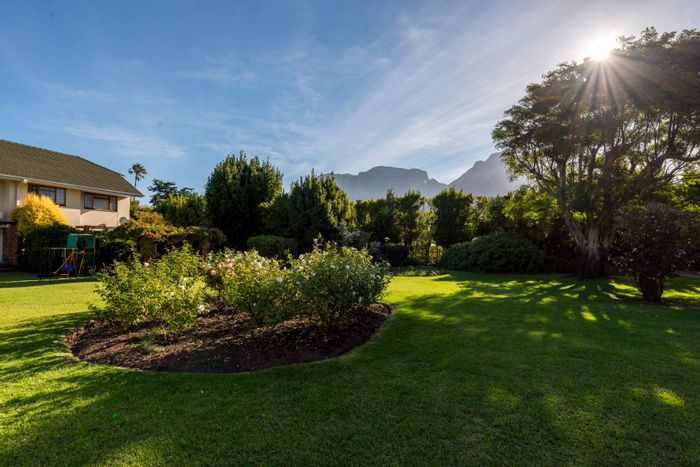 Rondebosch Apartment For Sale: Close to top schools, secure living, garden access.