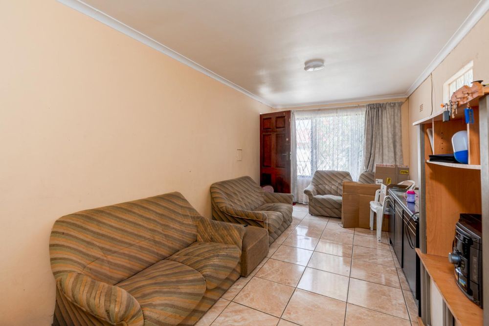 Twodwelling house in Grassy Park with garden, garage, and rental