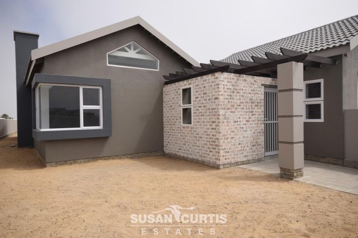 For Sale: House in Hage Heights with open plan living, outdoor BBQ, and garages.