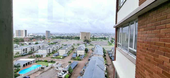 North Beach Apartment For Sale: Pool, braai area, city views, and covered parking.