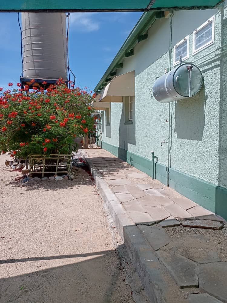 Side of the house with water tank