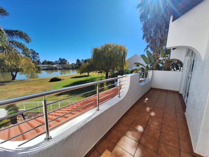 Townhouse For Sale in Vaal Marina Central: Waterfront access, boat house, community amenities.