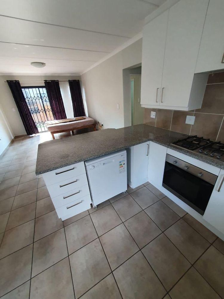Modern kitchen with granite tops and gas stove