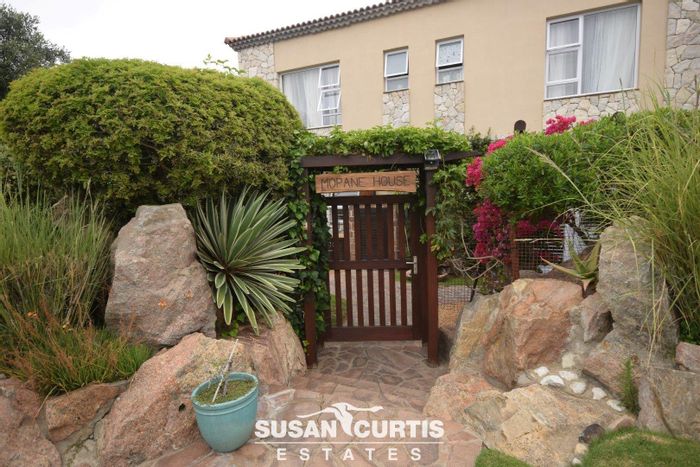 For Sale: Townhouse at Rossmund Golf Resort with golf membership, garage, and entertainment area.