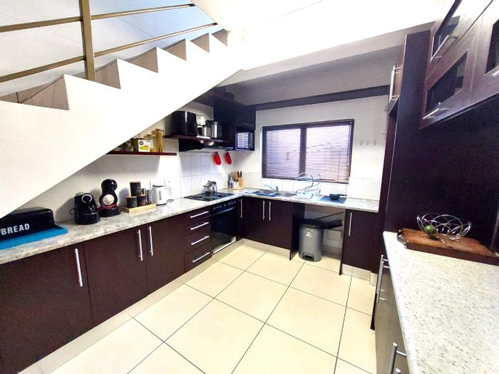 Modern Cimbebasia Townhouse for Sale: Corner Unit with Built-in Braai and Aircons