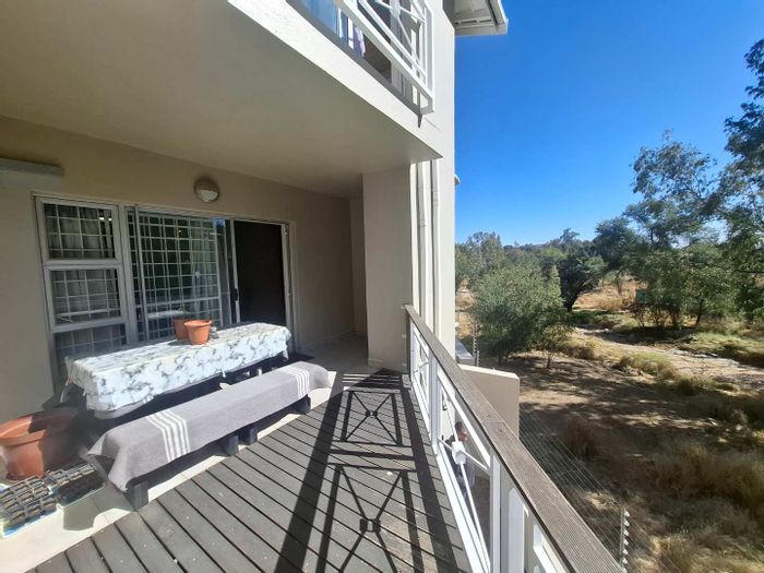 For Sale: Spacious Ludwigsdorf townhouse with 4-car garage, balcony, and study nook.