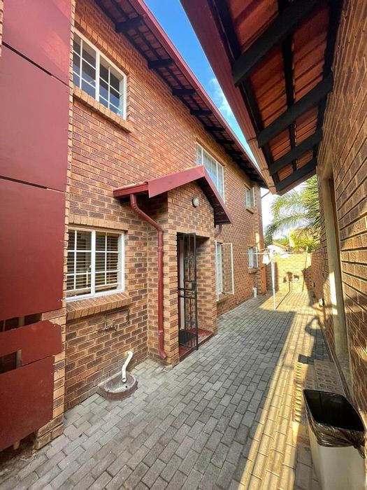 For Sale: Townhouse in The Reeds with 2 bedrooms, garages, and open living space.