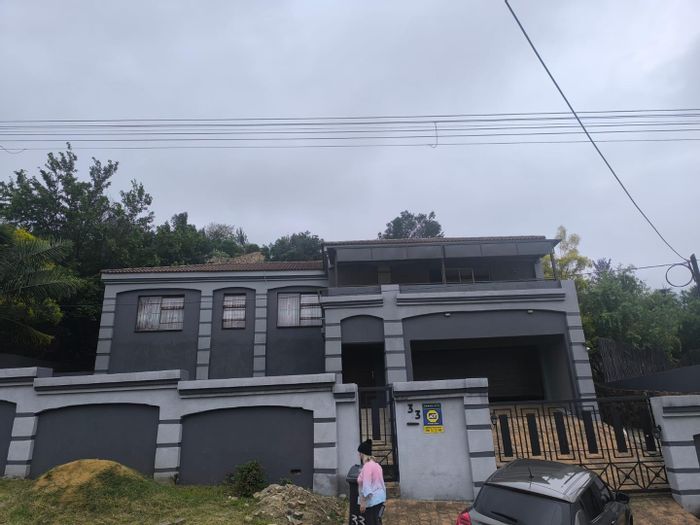 Spacious 4-bedroom house in Oakdene with garages, patios, and garden. For Sale.