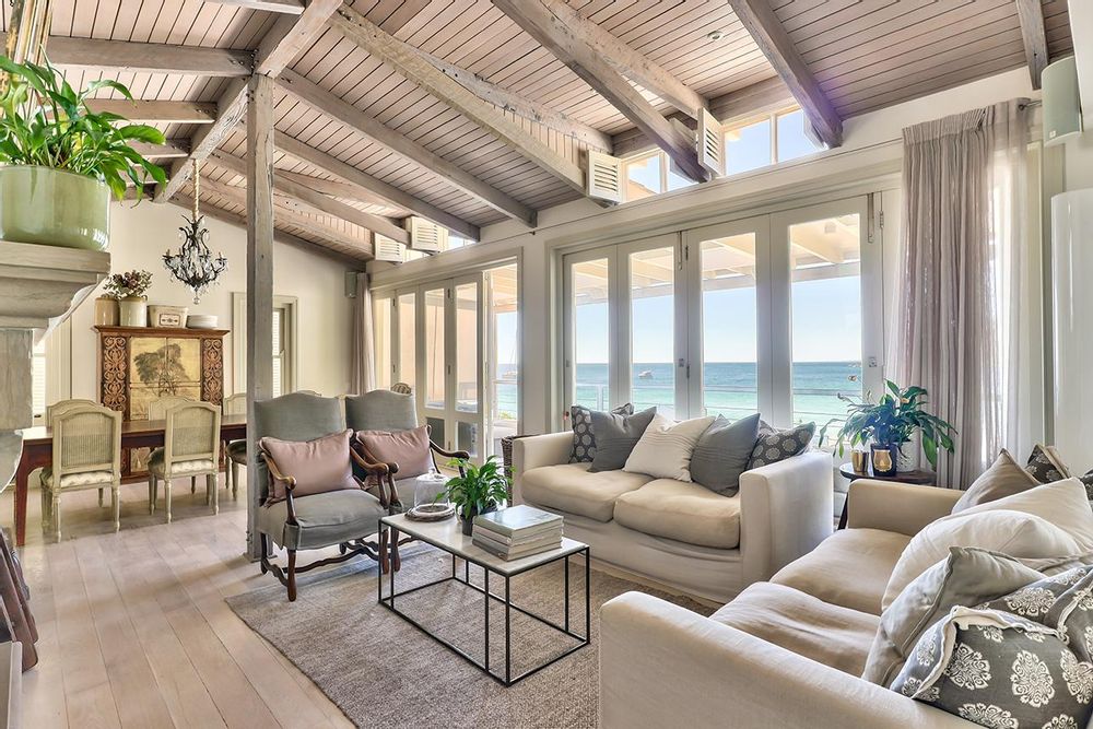 Open plan living with high white oak ceiling beacms and ocean views