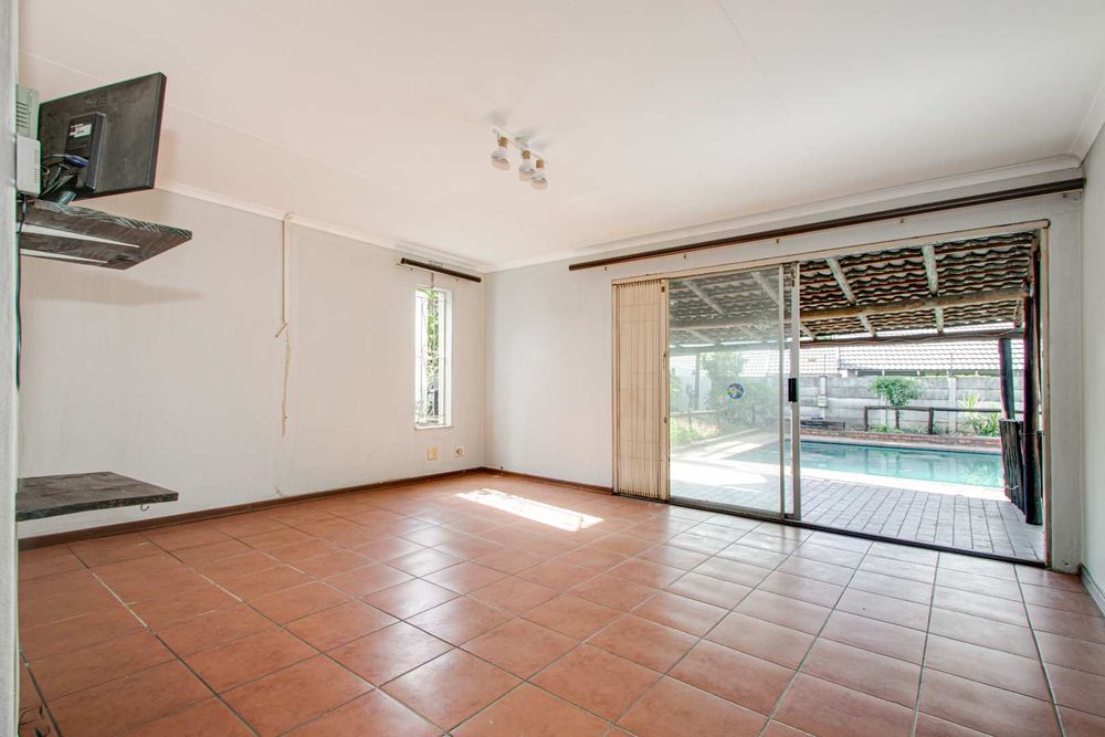 Lounge opening onto patio and pool area