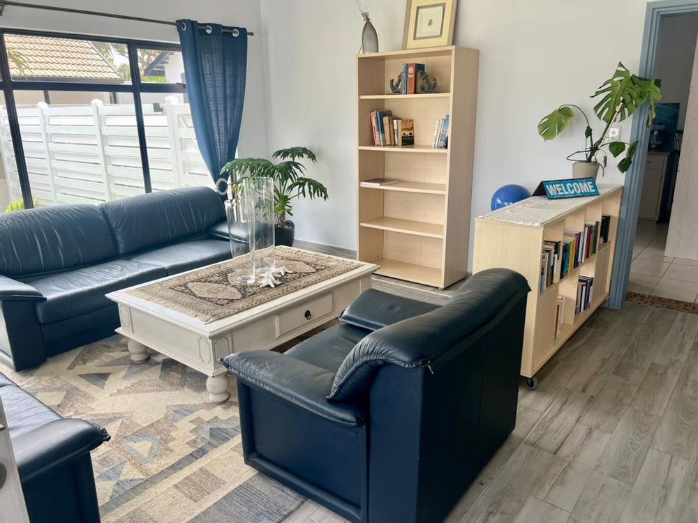 Downstairs lounge that leads to the laundry room