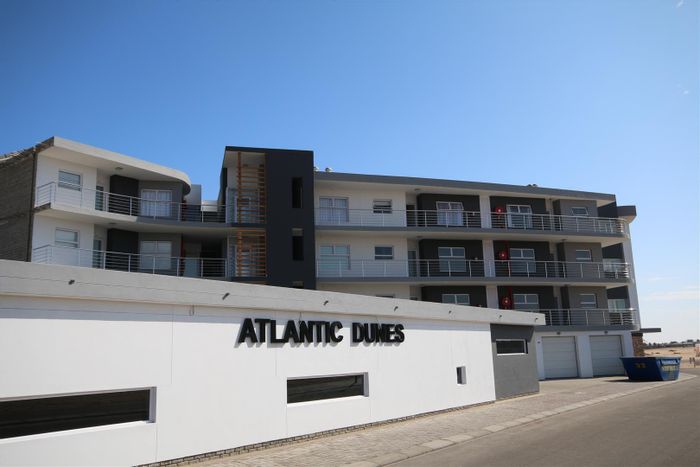 Dolphin Beach Apartment For Sale: Sea views, balcony, garage, rental income opportunity.