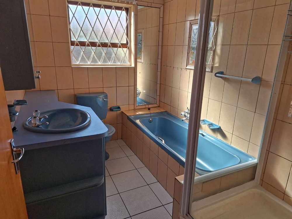 Family bathroom with shower and bath