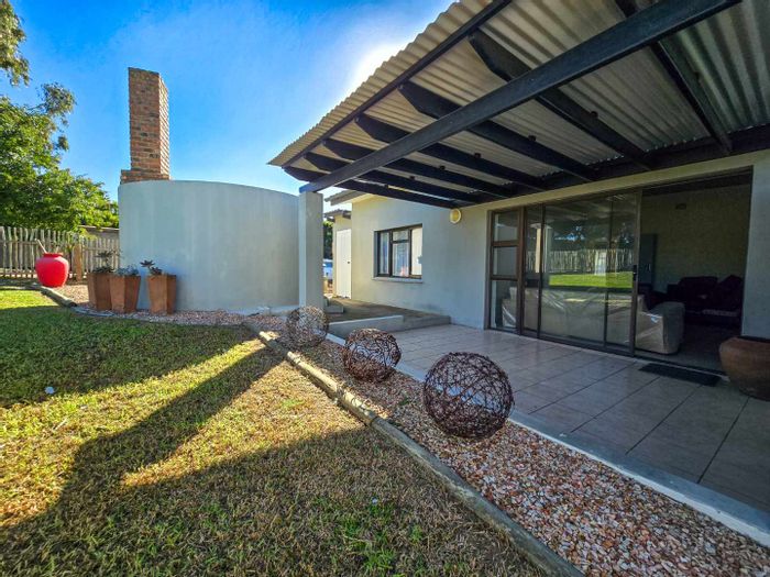 Coastal house for sale in Still Bay West with braai area and river views.