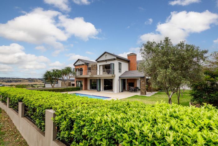 For Sale: House in Copperleaf Golf & Country Estate with golf views, pool, and amenities.