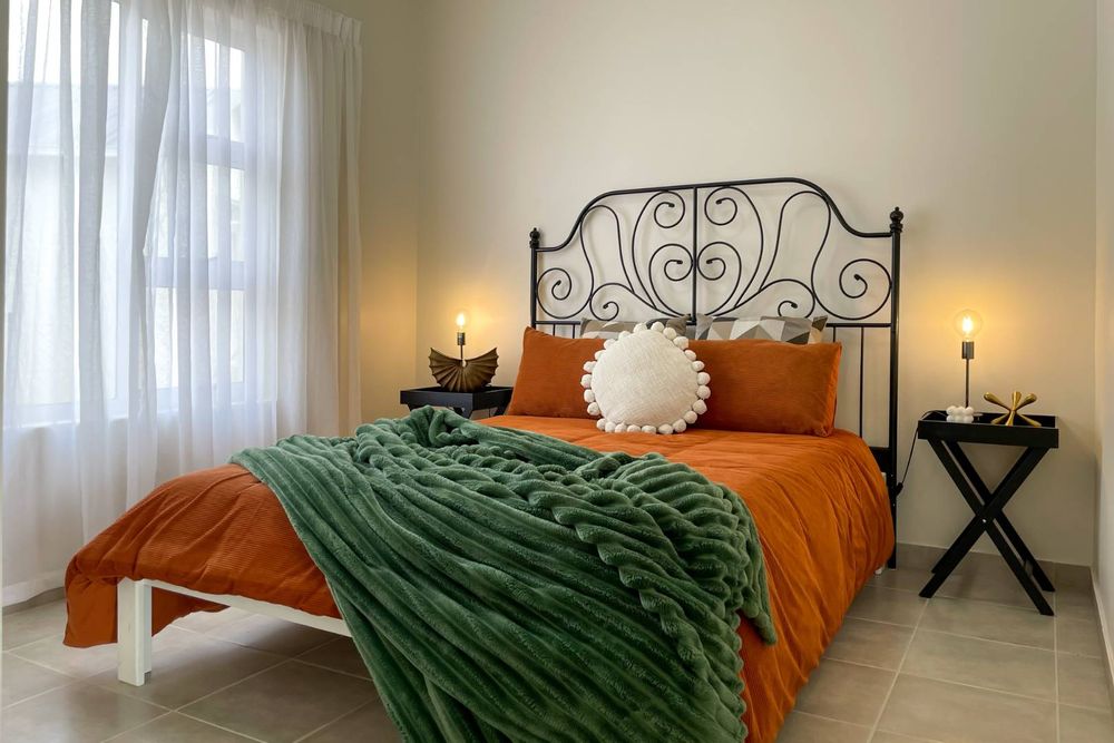 Main bedroom with built-in cupboards.