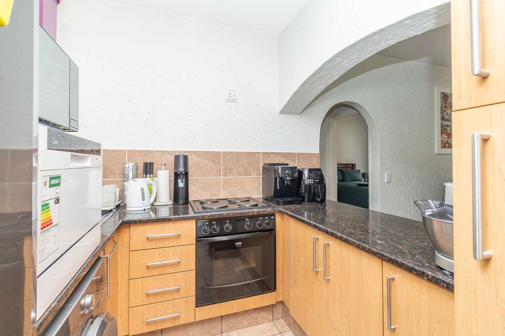 Kitchen with oven and stove view