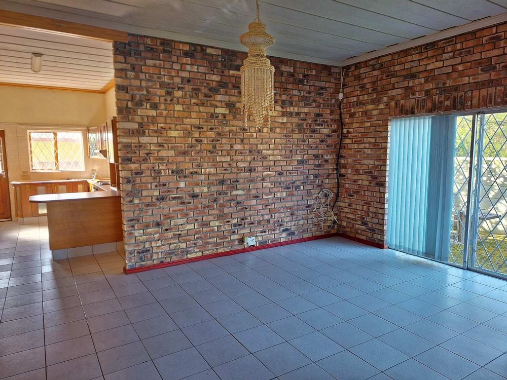 Living area with sliding door to enclosed front garden
