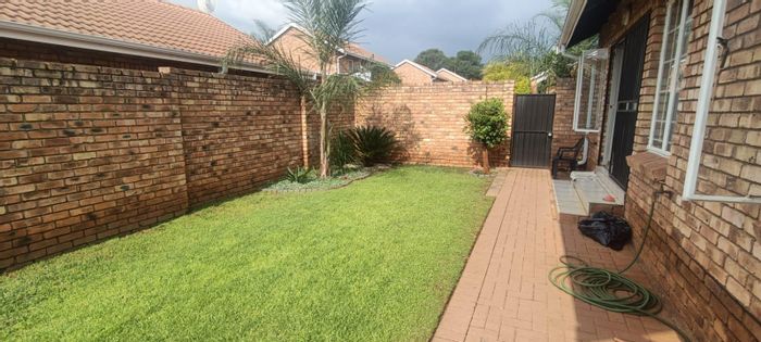 Hennopspark Townhouse For Sale: 2 beds, pet-friendly, double garage, garden, secure living.
