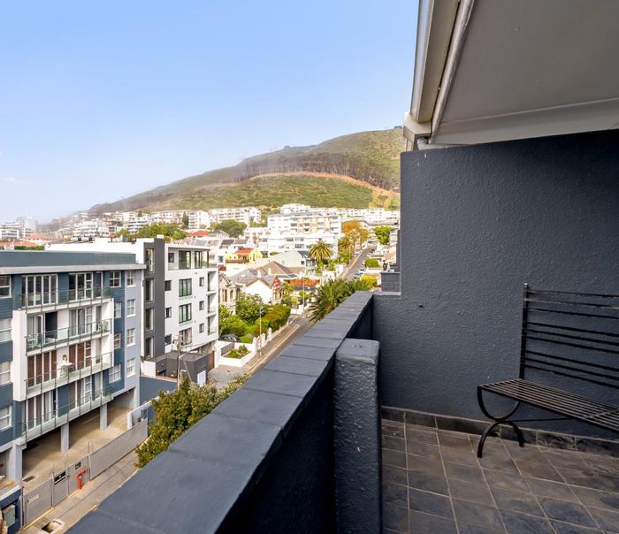 North-facing 2-bedroom apartment in Sea Point with balcony and secure parking. For Sale.