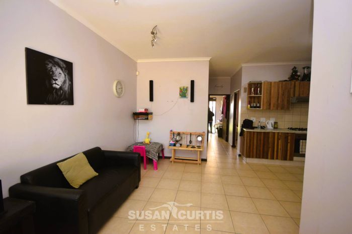 For Sale: 2-Bedroom Townhouse in Fairways Estate with yard, garage, and pet-friendly.