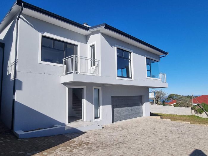 For Sale: House in Dana Bay with sea views, open plan living, and garage.