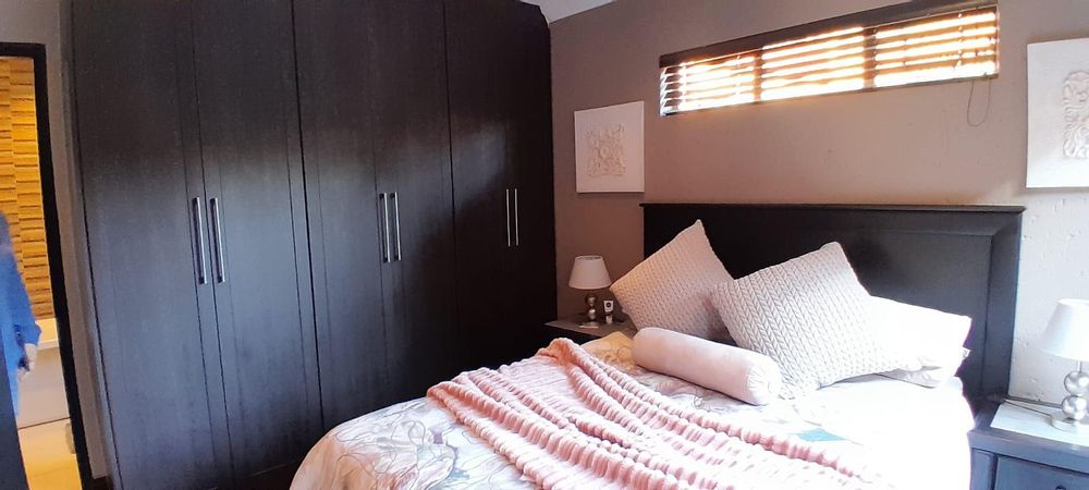 Bedroom 1 with plenty of built in cupboards