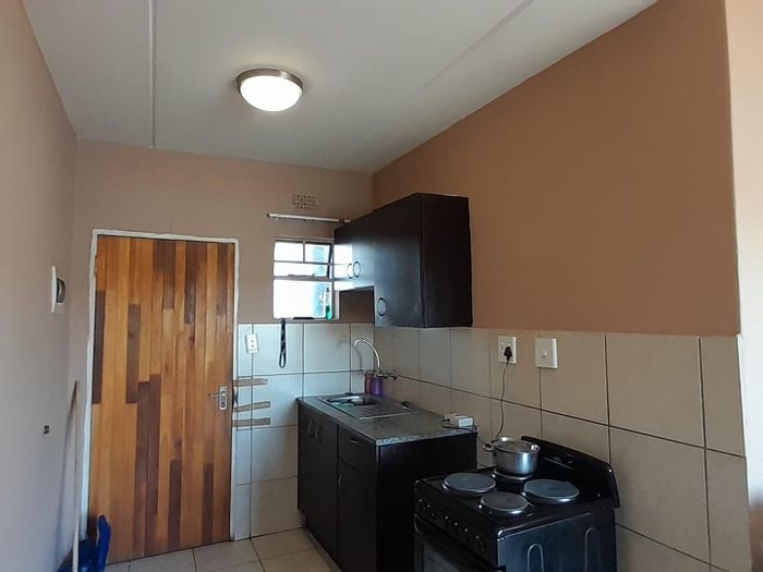 2-Bedroom Apartment For Sale in Fleurhof with cozy kitchen and open parking.