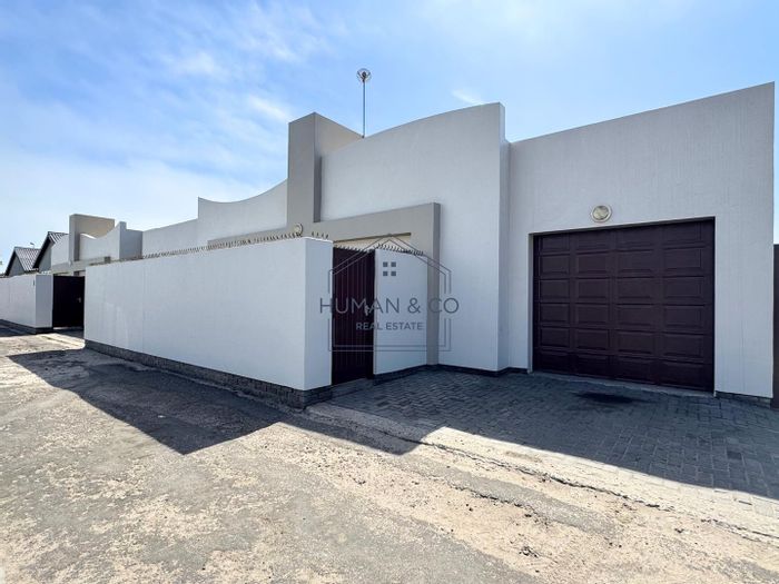 Townhouse for Sale in Walvis Bay Central: 2 Bedrooms, Garage, Private Courtyard.