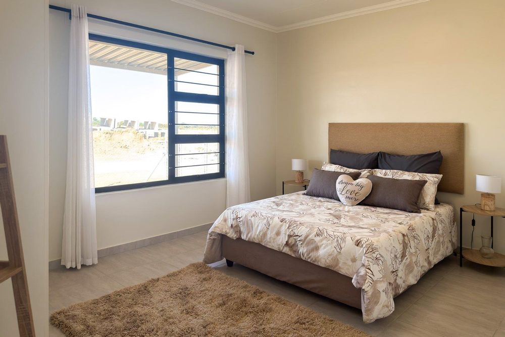 Main bedroom with built-in cupboards.