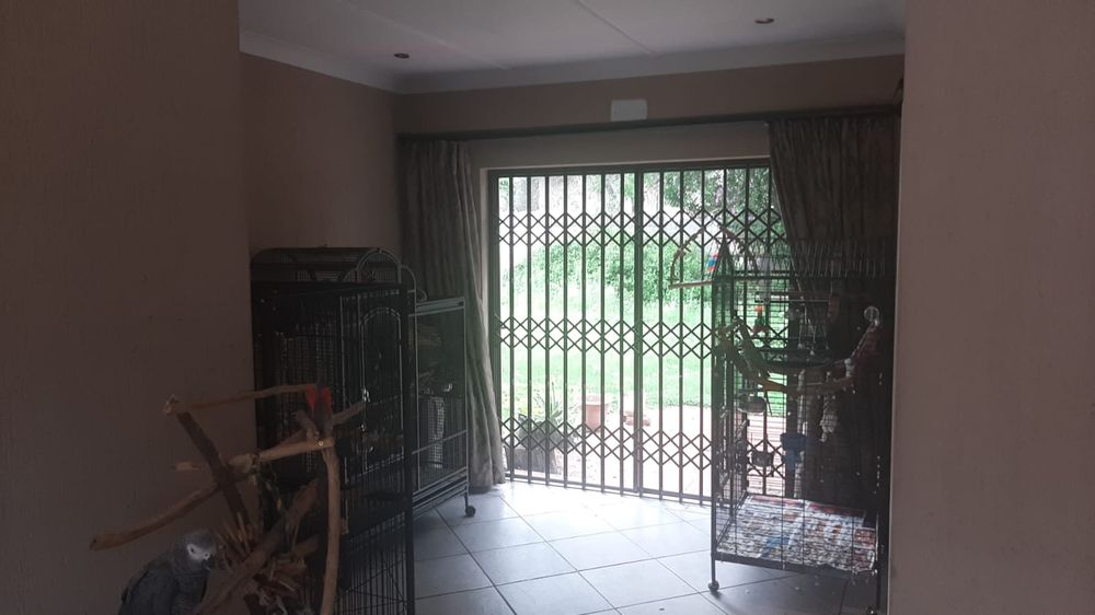 Open plan dining room leading into large backyard with good security