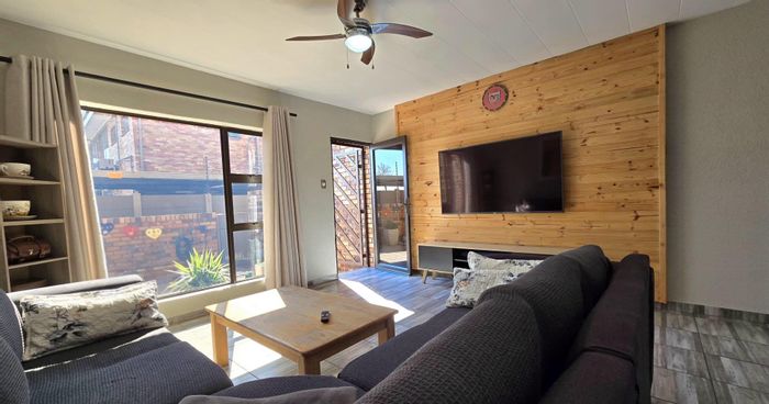 For Sale: Apartment in New Redruth with garage, outdoor laundry, and private backyard.