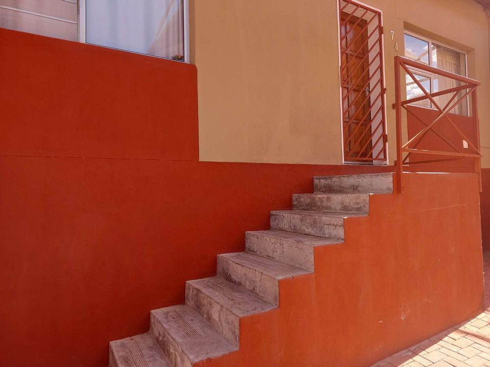 Stairway to front door of unit