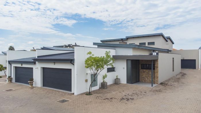 For Sale: Townhouse in Equestria with 2 garages, security, and play area.