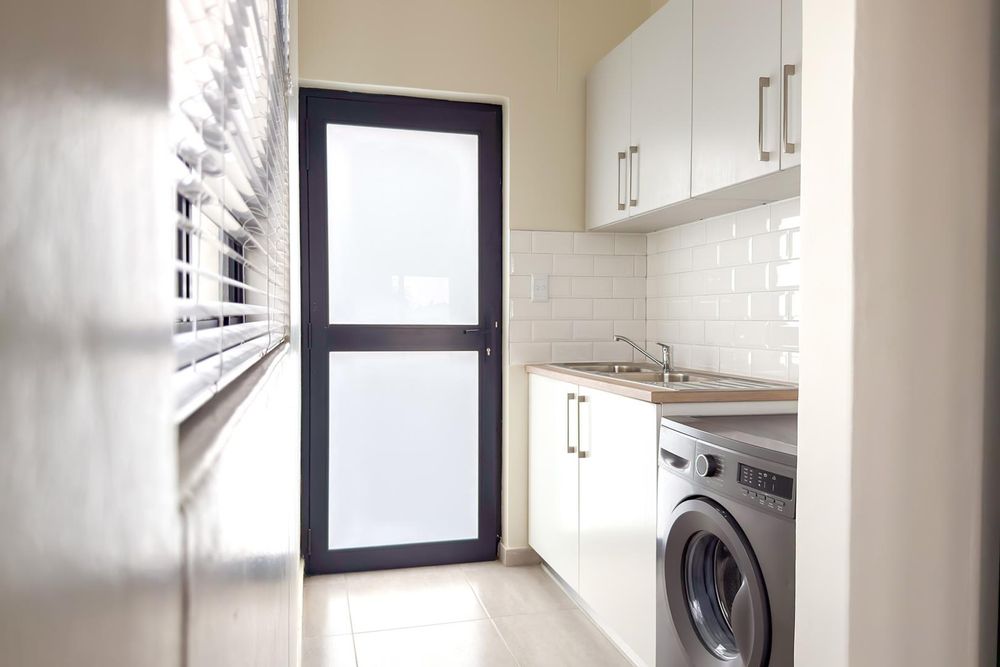 Kitchen scullery with even more cupboards.