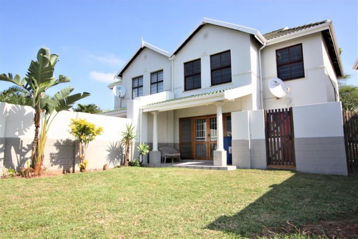 3-bedroom townhouse in Umhlanga Central with garden, garage, and security features. To Rent.