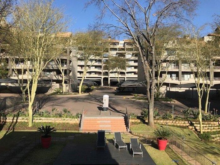 To Rent: Spacious 2-Bedroom Apartment in Sandton Central with secure parking.