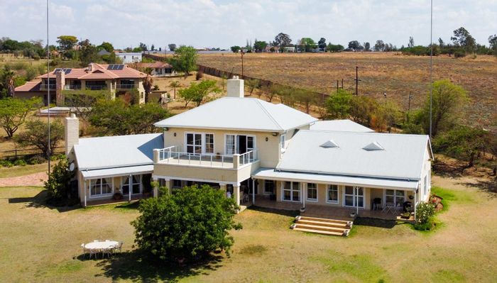 For Sale: House in Blue Hills with 4 bedrooms, patio, and expansive grounds.