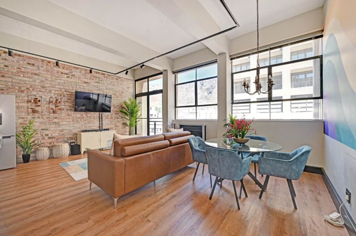 Cape Town City Centre Apartment For Sale: Airbnb-ready, balcony views, secure parking.