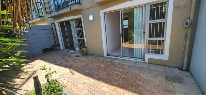 Ground floor apartment in Table View with private garden, garage, and secure access.