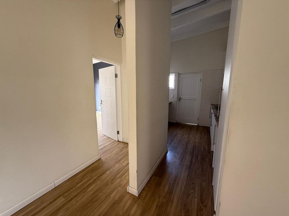 hallway to scullery and 1st bedroom