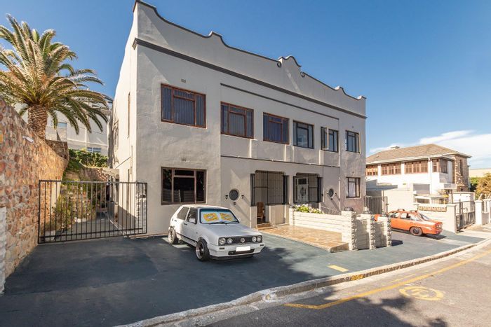 Charming Muizenberg Central Apartment for Sale: 3 Bedrooms, Communal Garden & Patios!